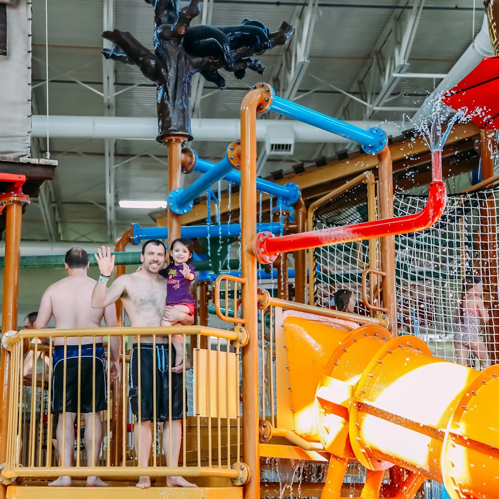 a group of people playing in a water park