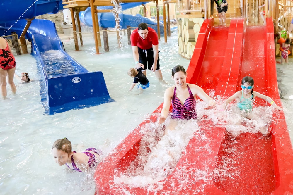 a group of children playing in a water park