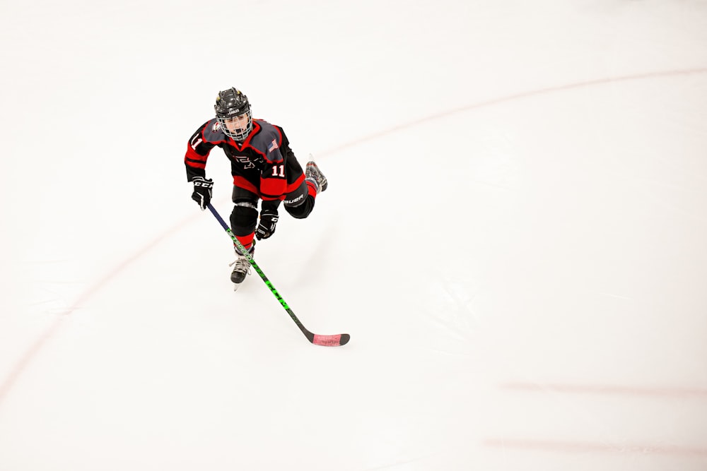 a hockey player is going down the ice