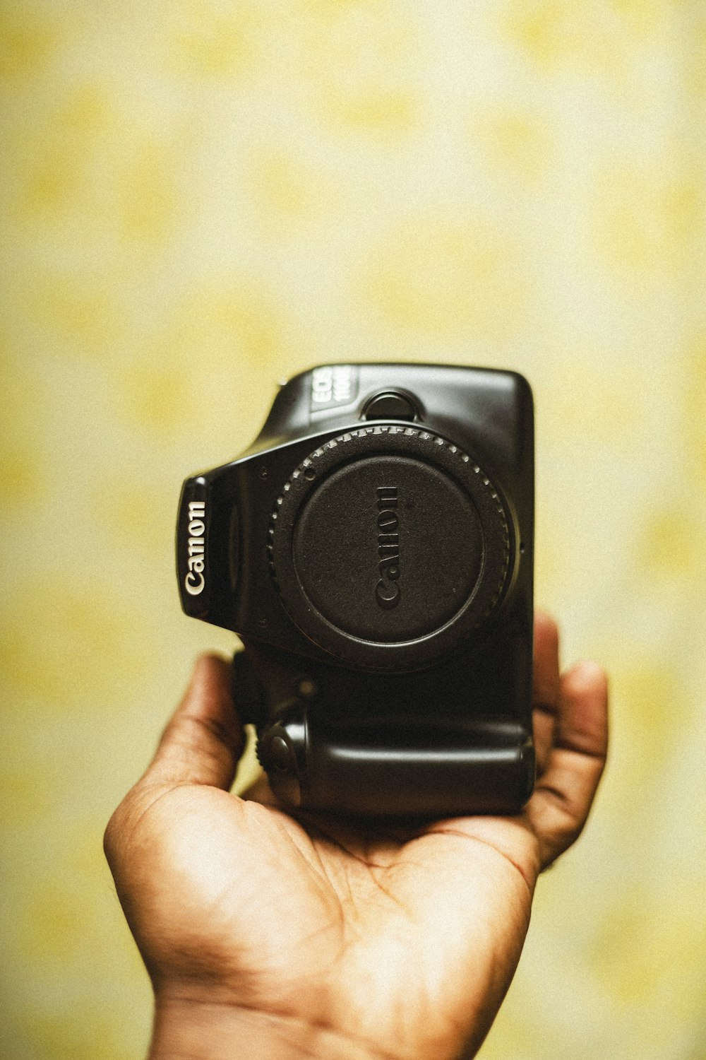 a person holding a camera in their hand