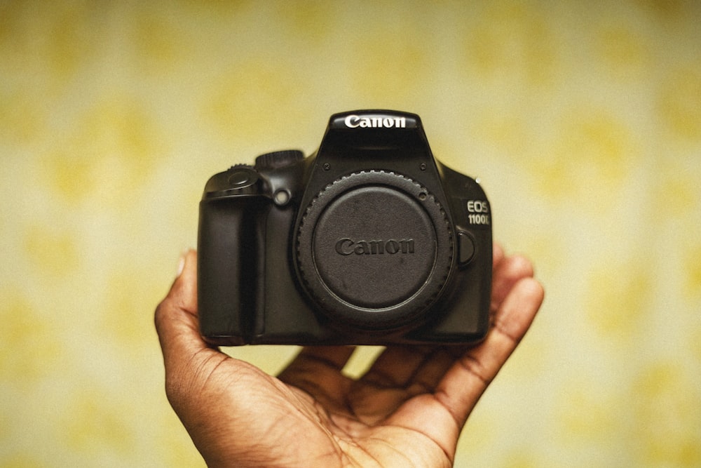 a person holding a camera in their hand