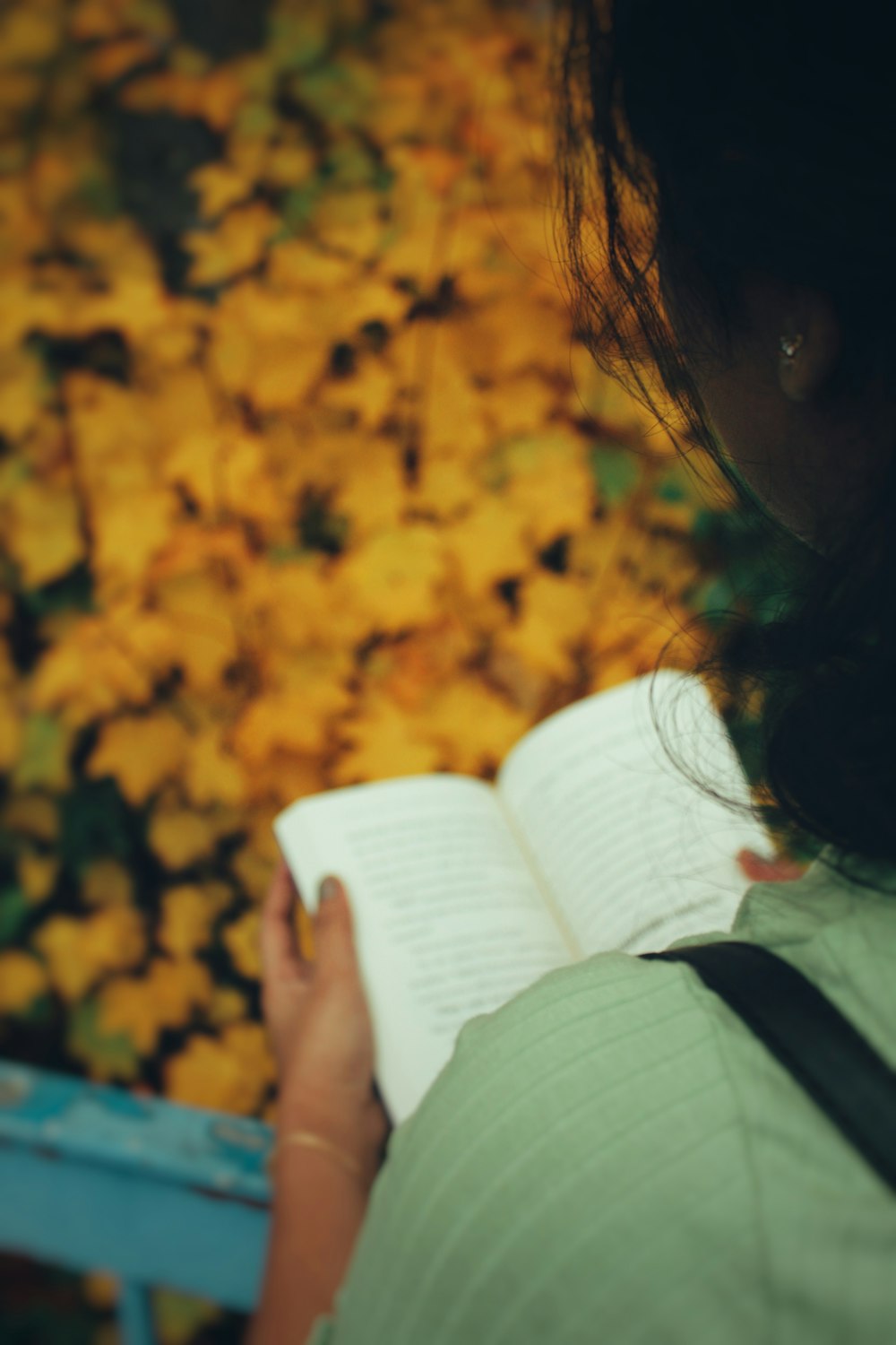 a woman holding a book in her hands