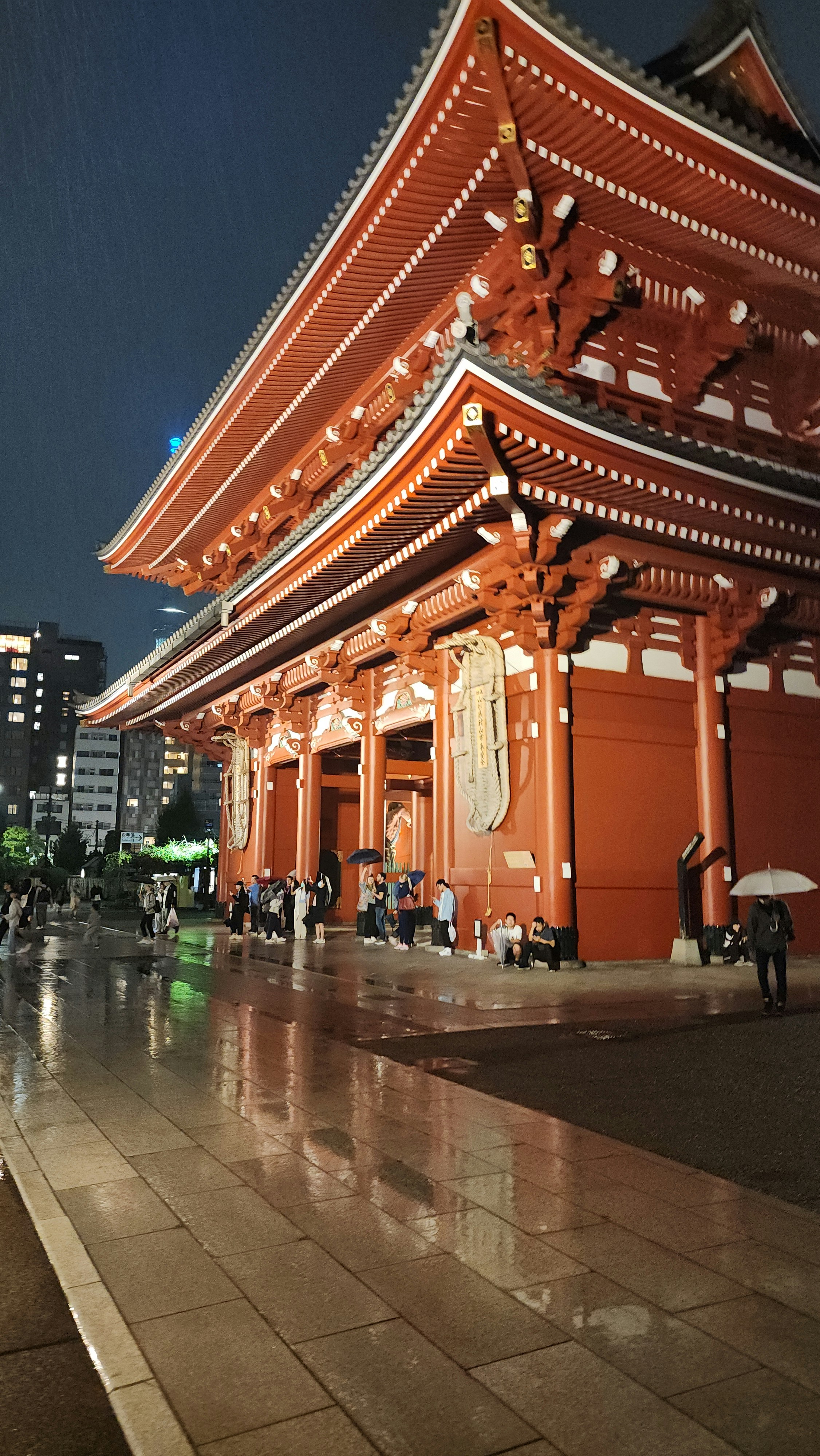 a building with a lot of people walking around it