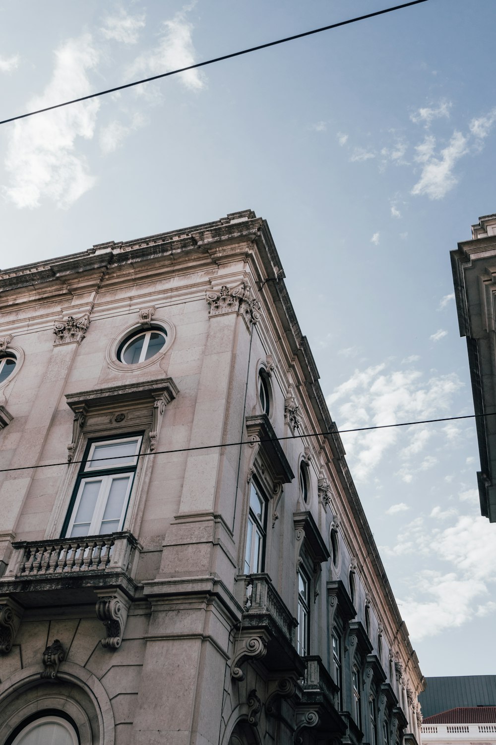 a tall building with a clock on the front of it