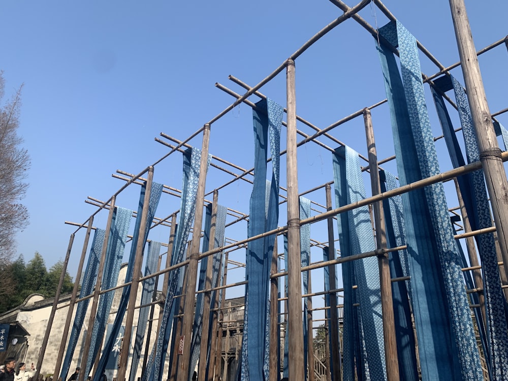 a group of blue metal structures against a blue sky
