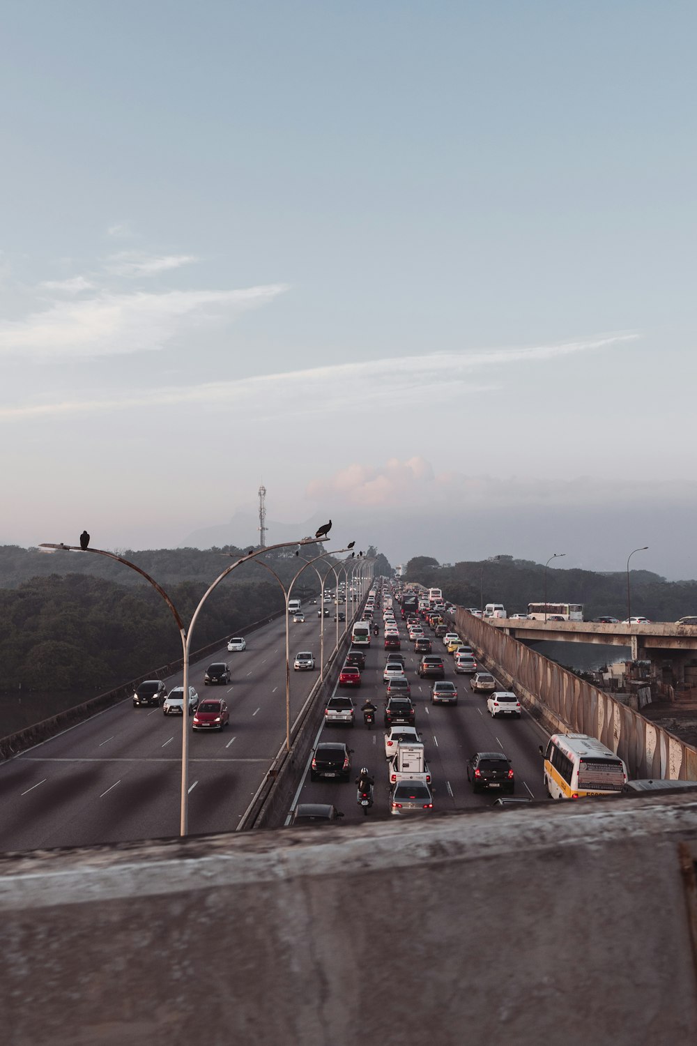 a highway filled with lots of traffic under a blue sky