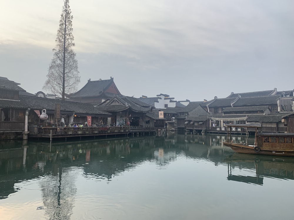 a body of water surrounded by wooden buildings