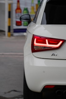 a close up of the tail light of a white car