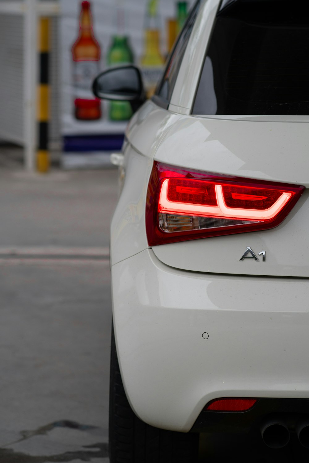 a close up of the tail light of a white car