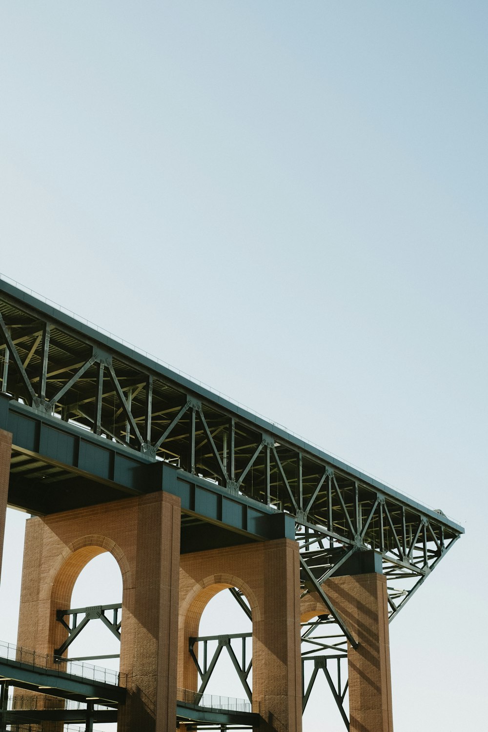 a large bridge with arches and a sky background