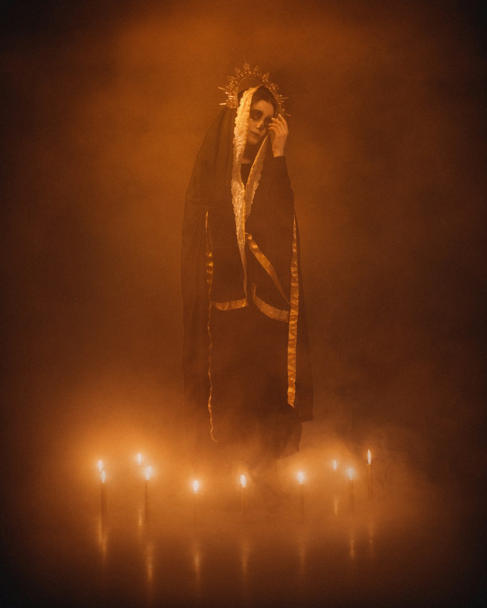 a man dressed in a costume standing in a foggy area