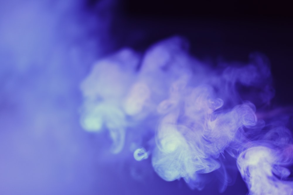 a blurry photo of smoke on a black background