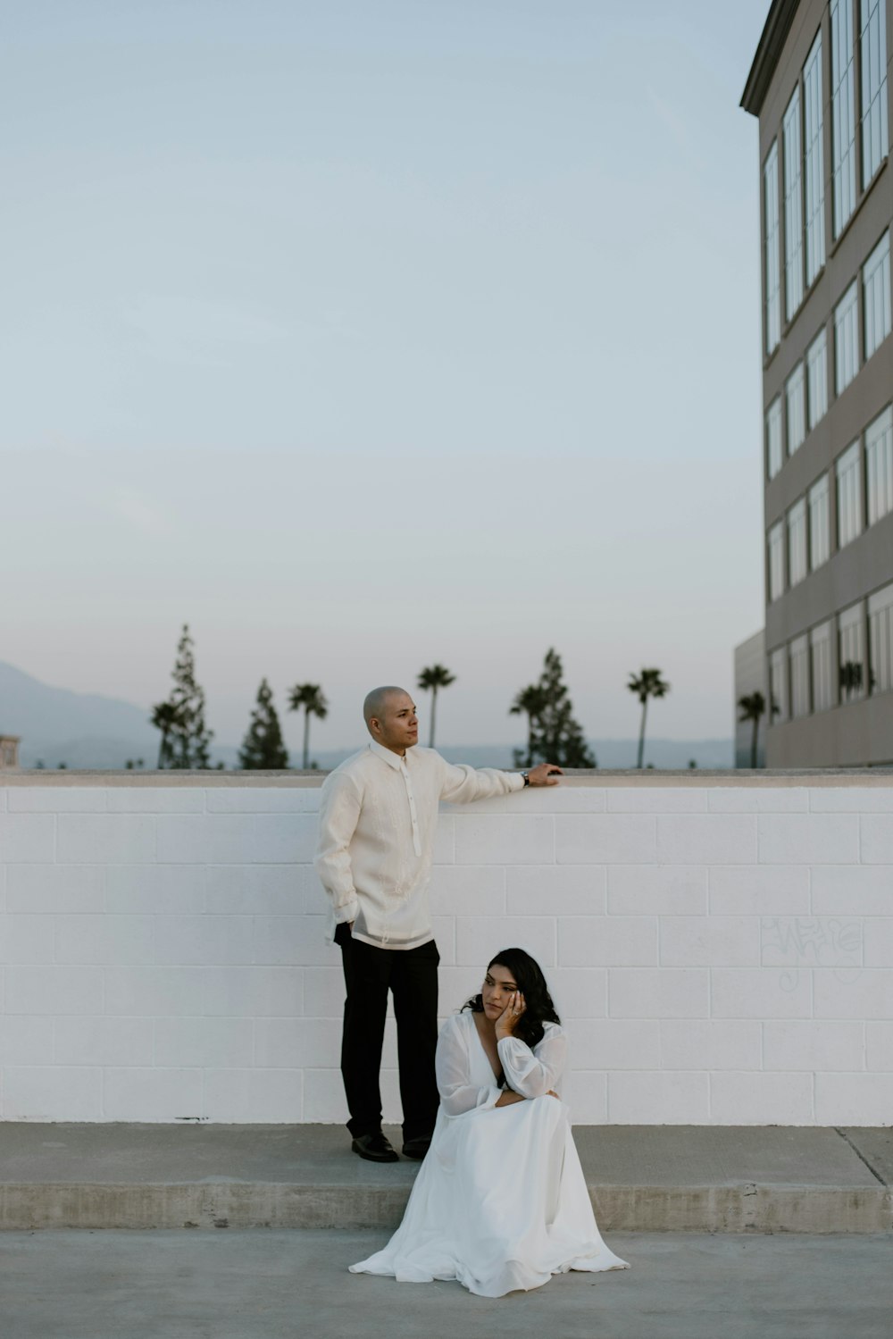 a man and a woman standing next to each other