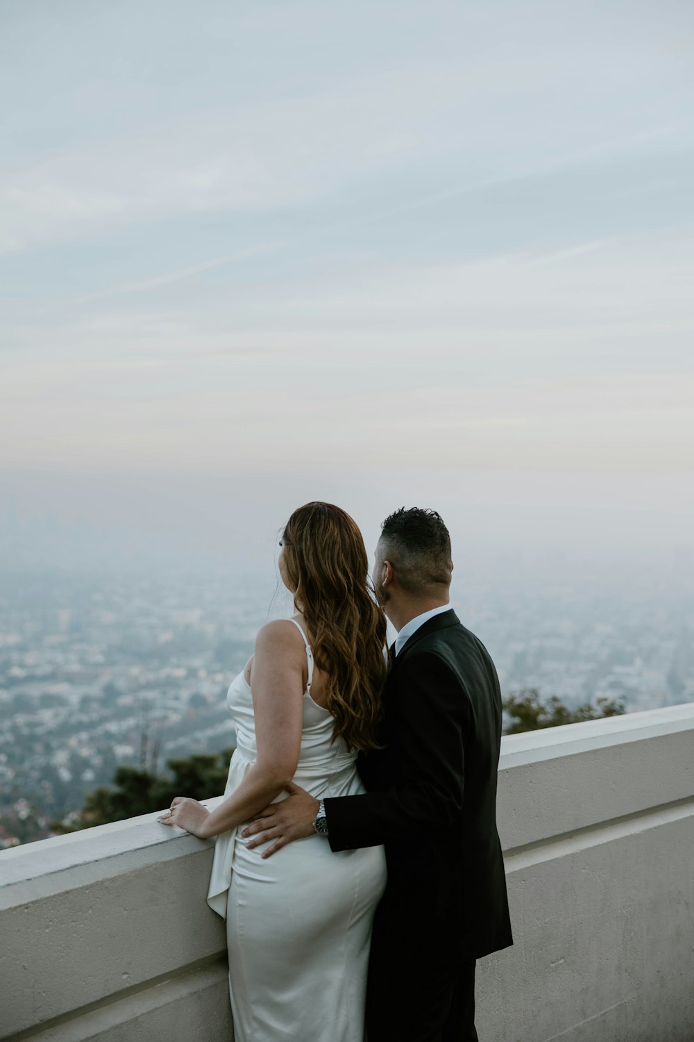 a man and a woman standing next to each other