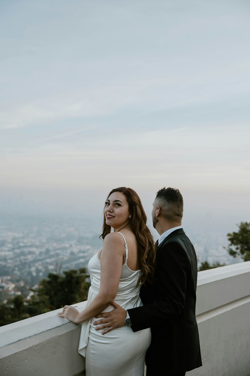 a man and a woman standing next to each other