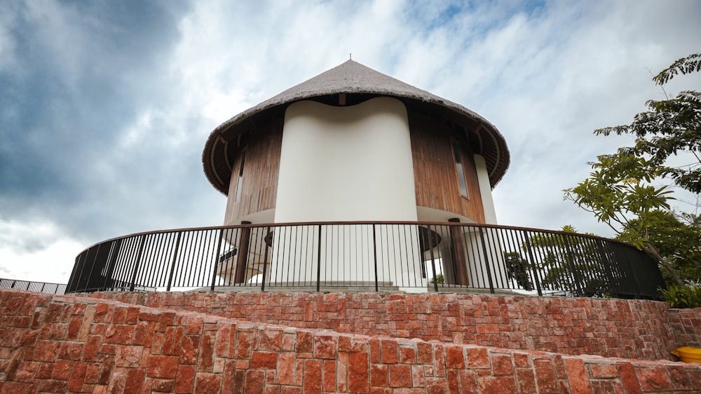 a round building with a metal fence around it