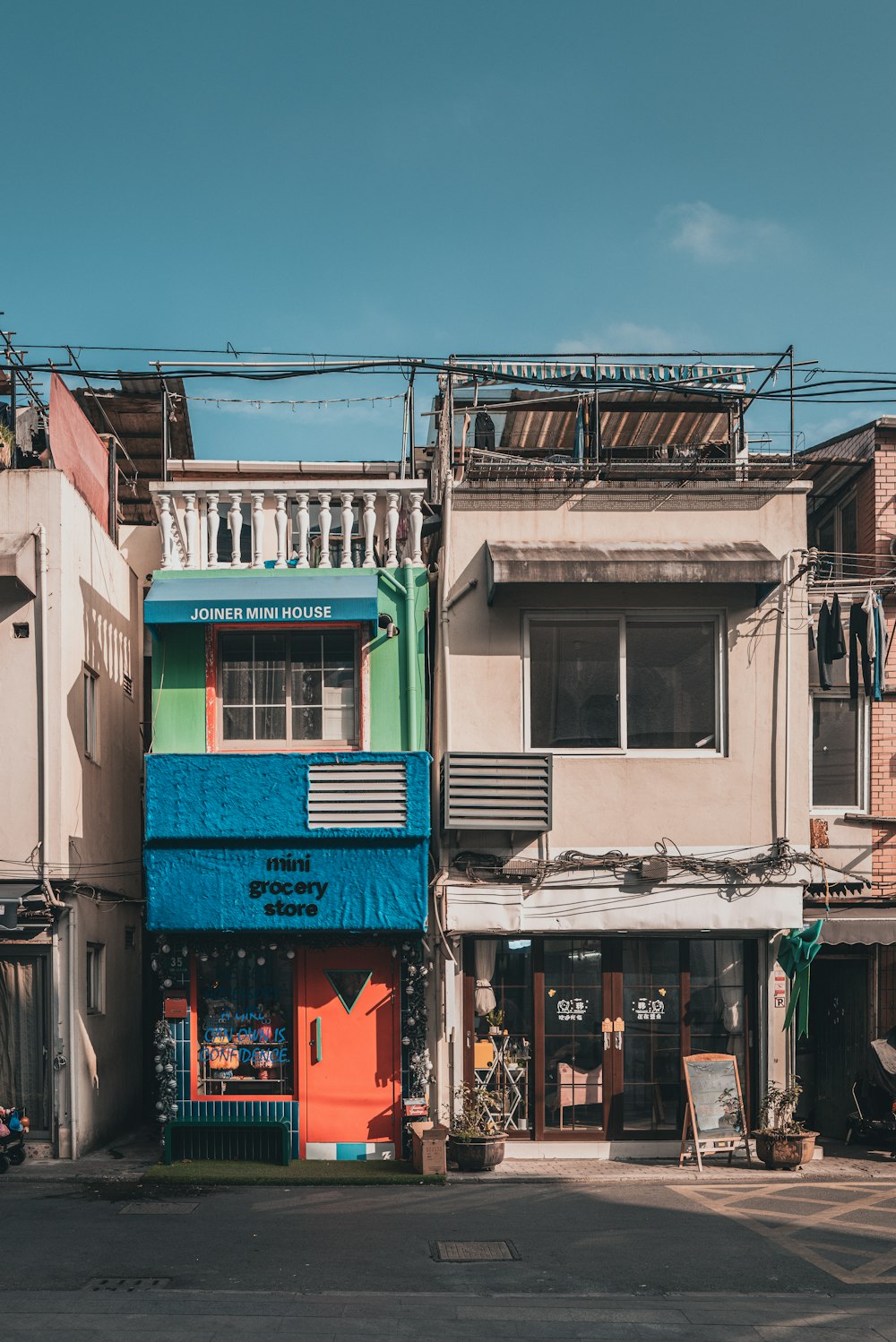 a multi - colored building on a street corner