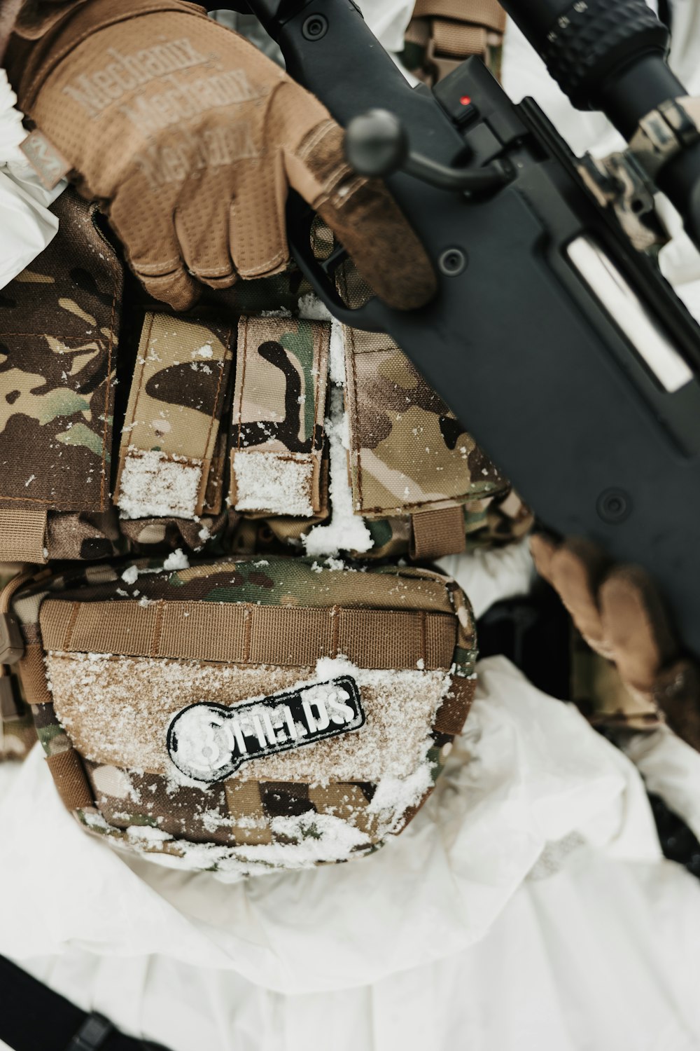 a close up of a person holding a rifle