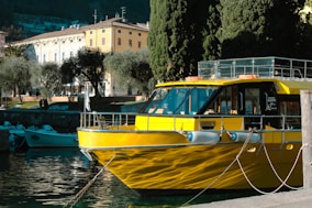 a yellow boat is docked in the water