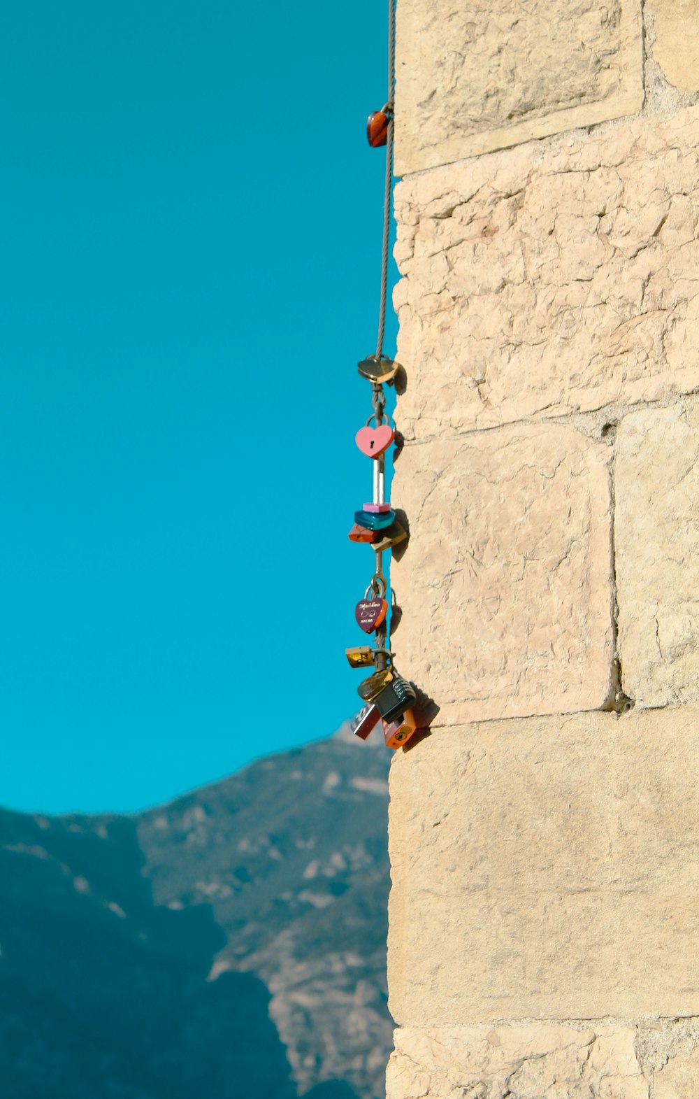 a group of shoes hanging from the side of a building