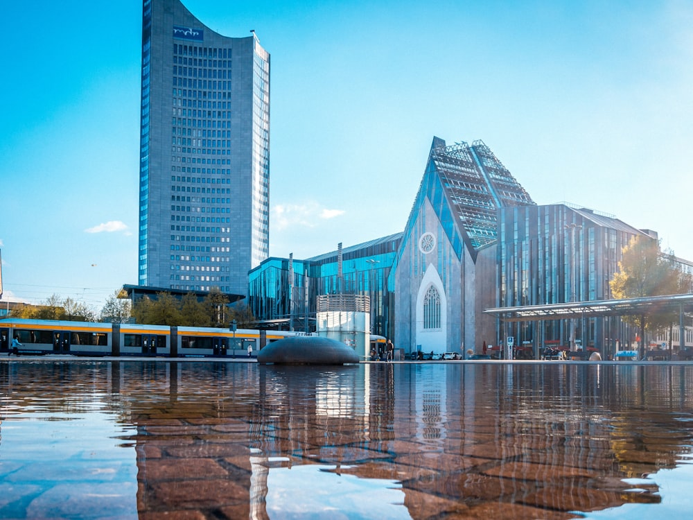 a large building sitting next to a large body of water