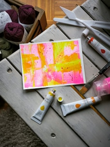 a picture of some paint and some crochet hooks