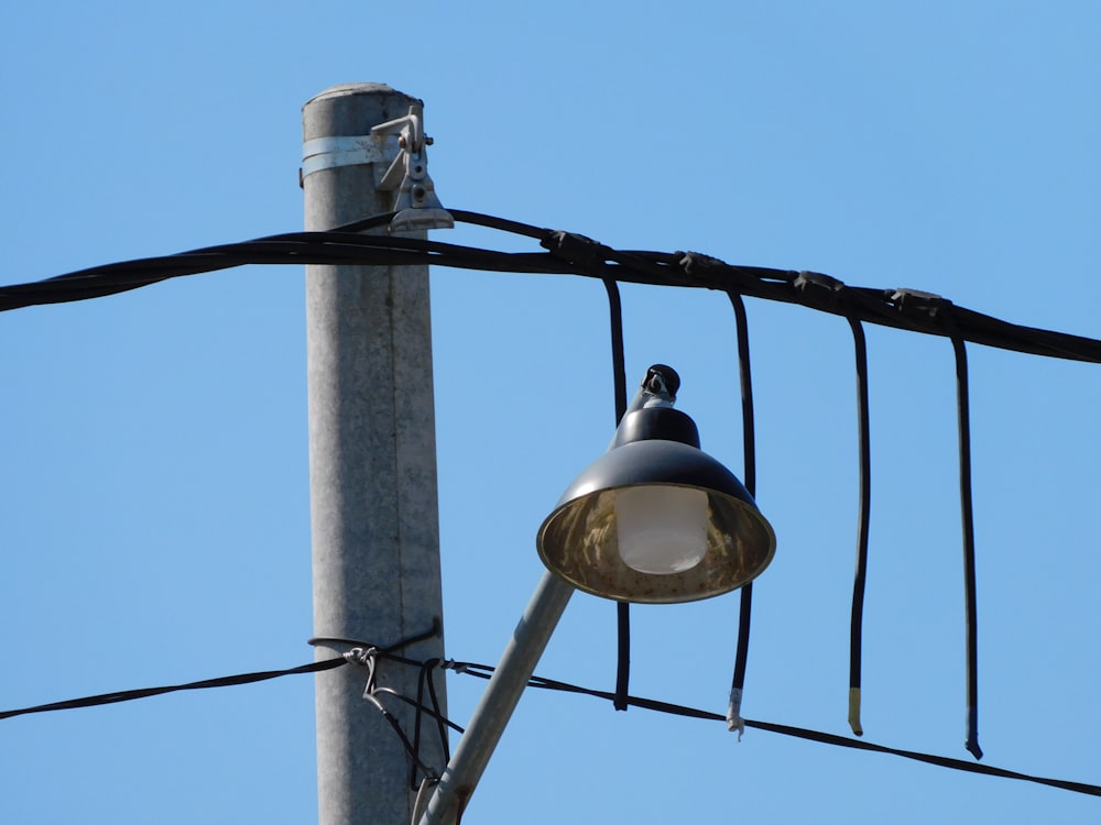 a street light sitting next to a power pole