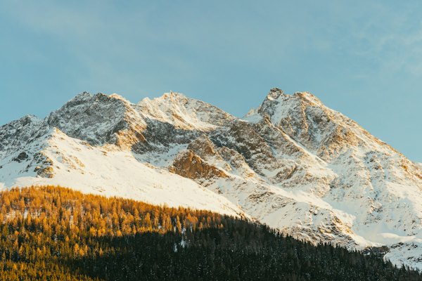 A snow covered mountain with trees in the foreground — St. Anton am Arlberg, Austria