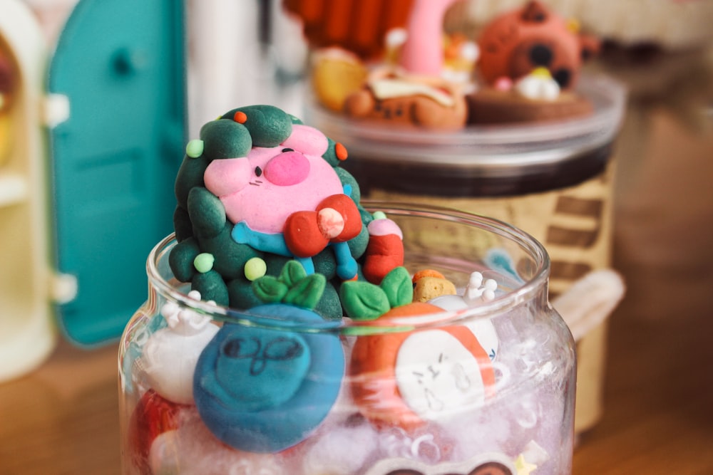 a glass jar filled with lots of candies
