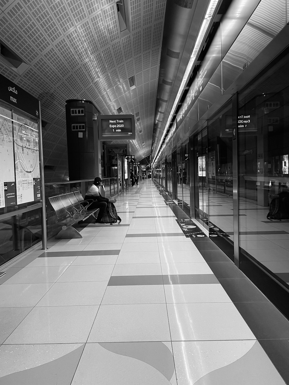 a black and white photo of a train station