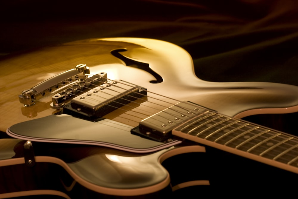 a close up of a guitar on a table