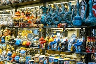 a display case filled with lots of colorful vases