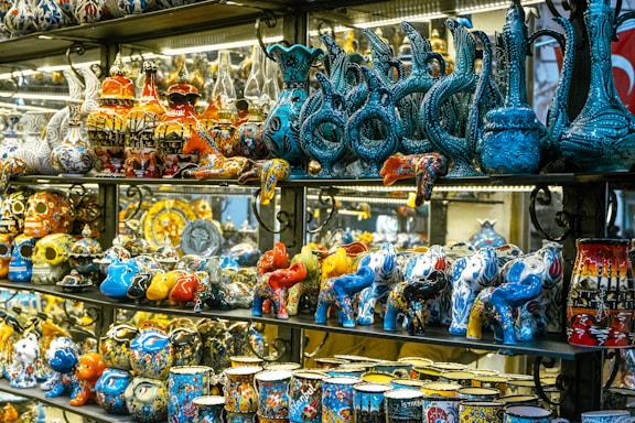 a display case filled with lots of colorful vases