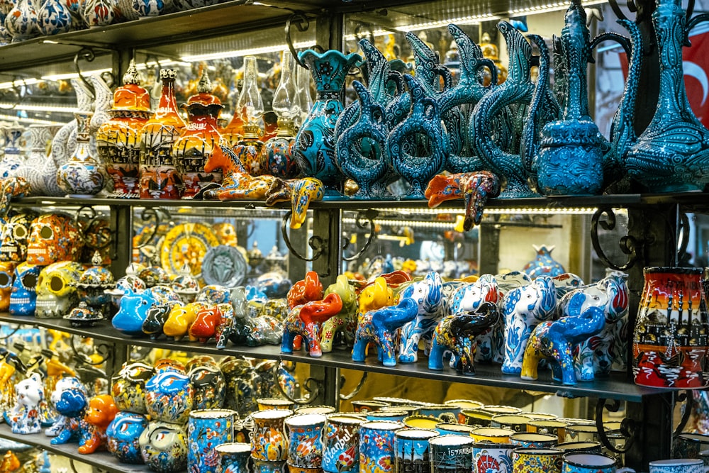 a display case filled with lots of colorful vases