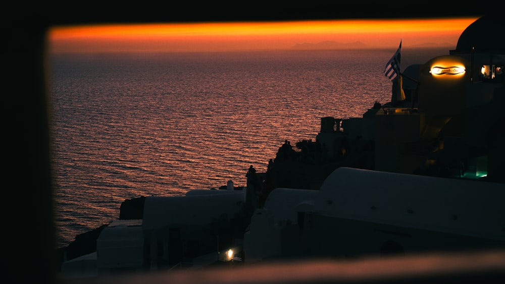 a view of the ocean at sunset from a ship