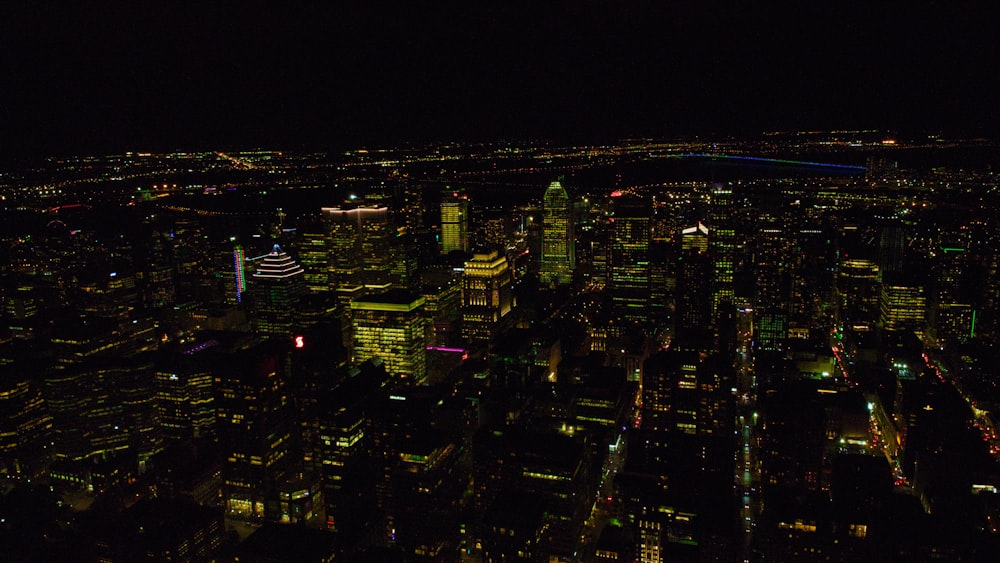 a view of a city at night from the top of a building