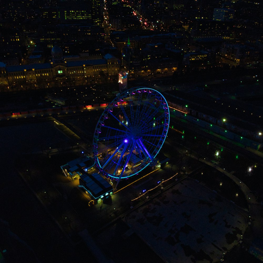 an aerial view of a ferris wheel at night