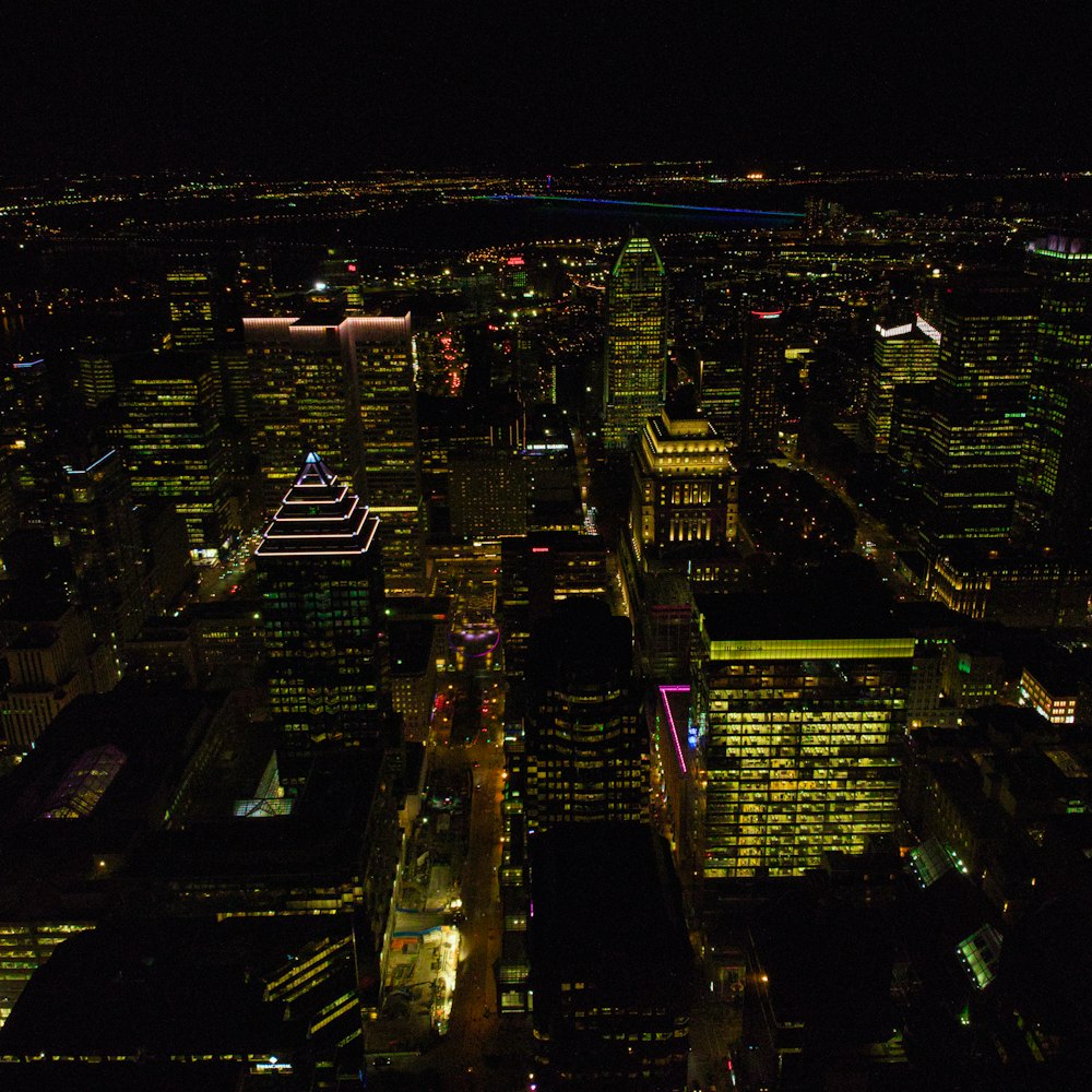 a view of a city at night from the top of a building