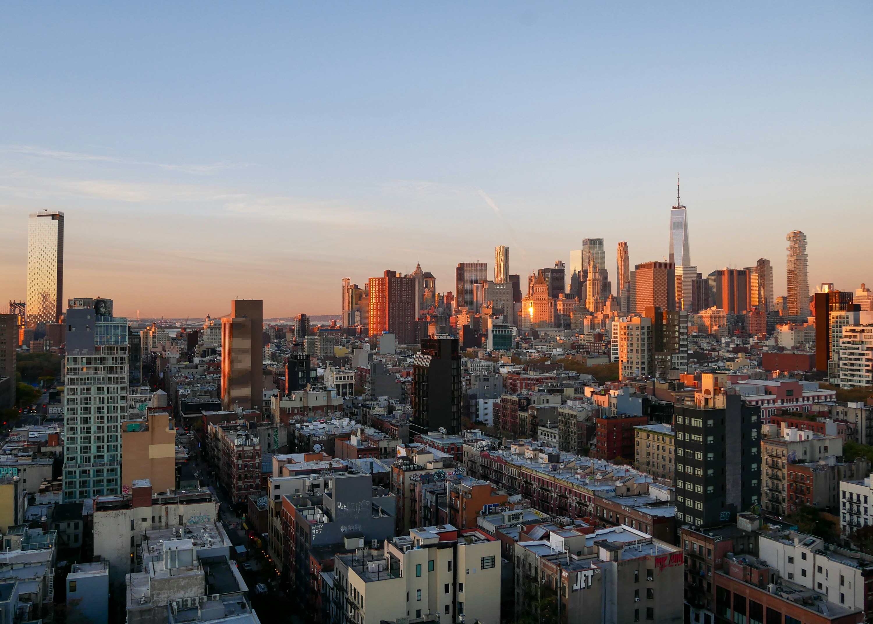 a view of a city skyline at sunset