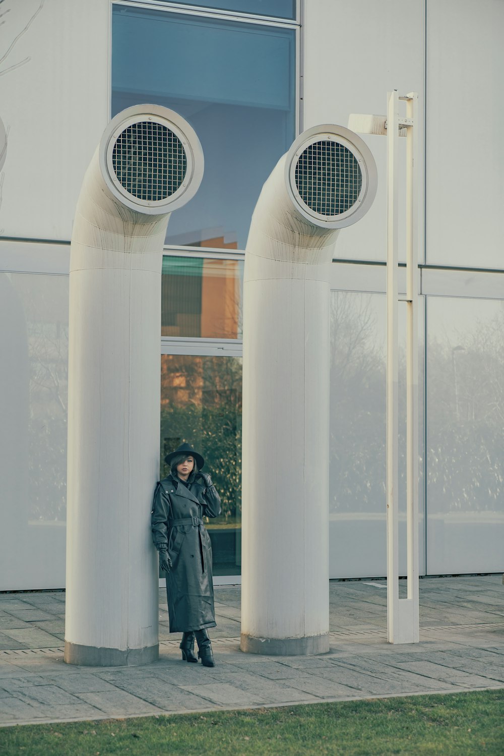 a person standing in front of two large speakers
