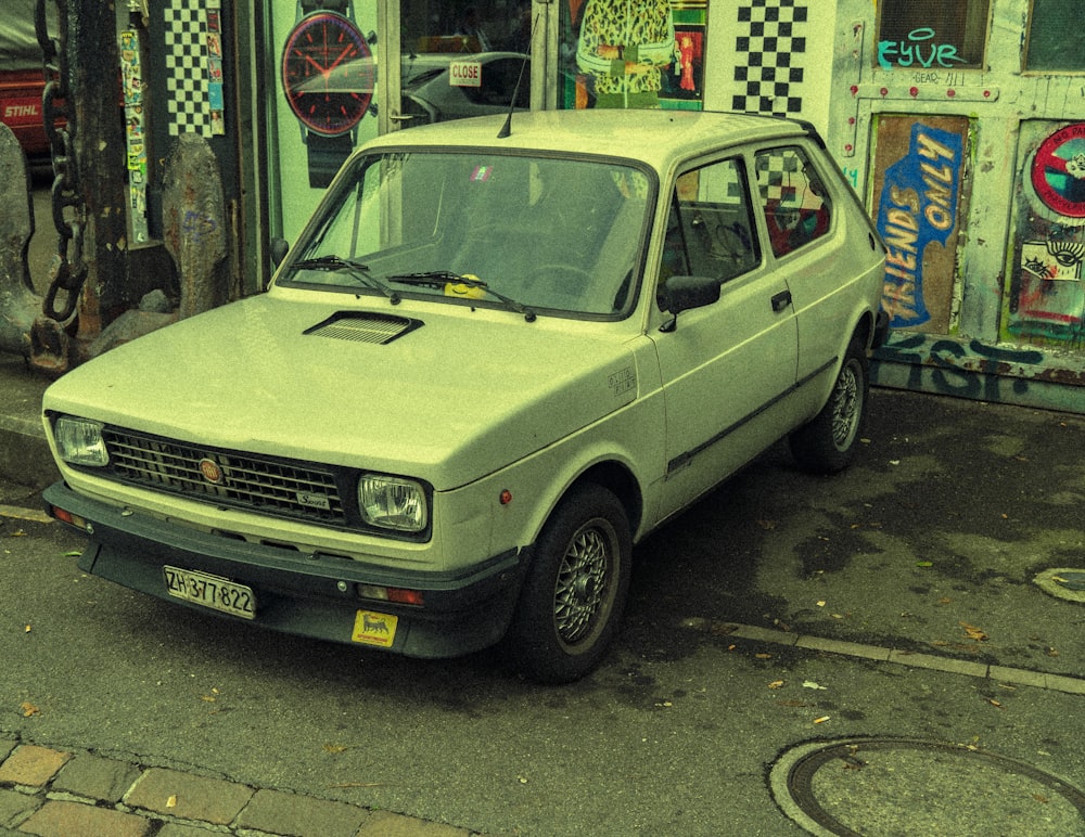 a small car parked in front of a store