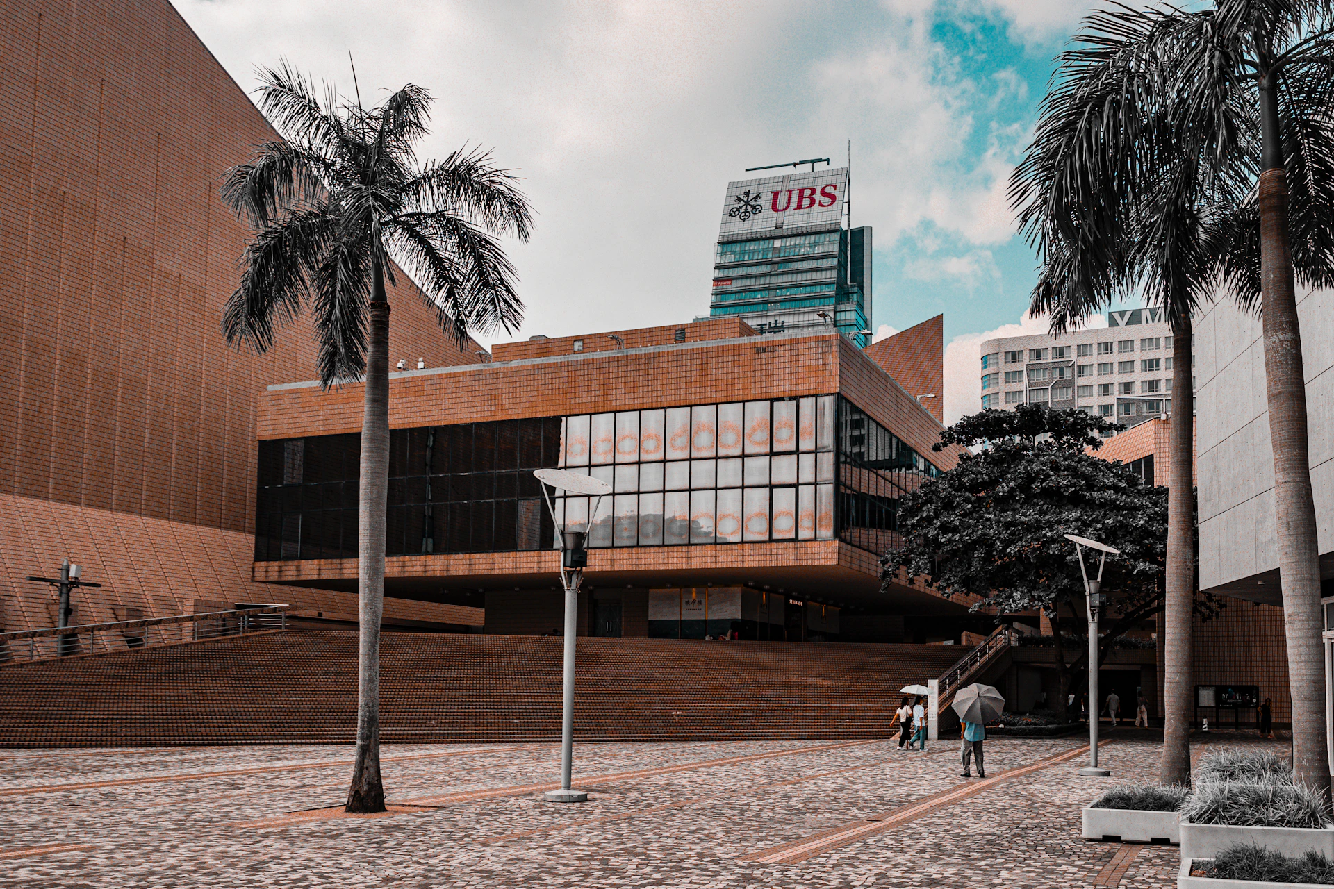 a building with palm trees in front of it