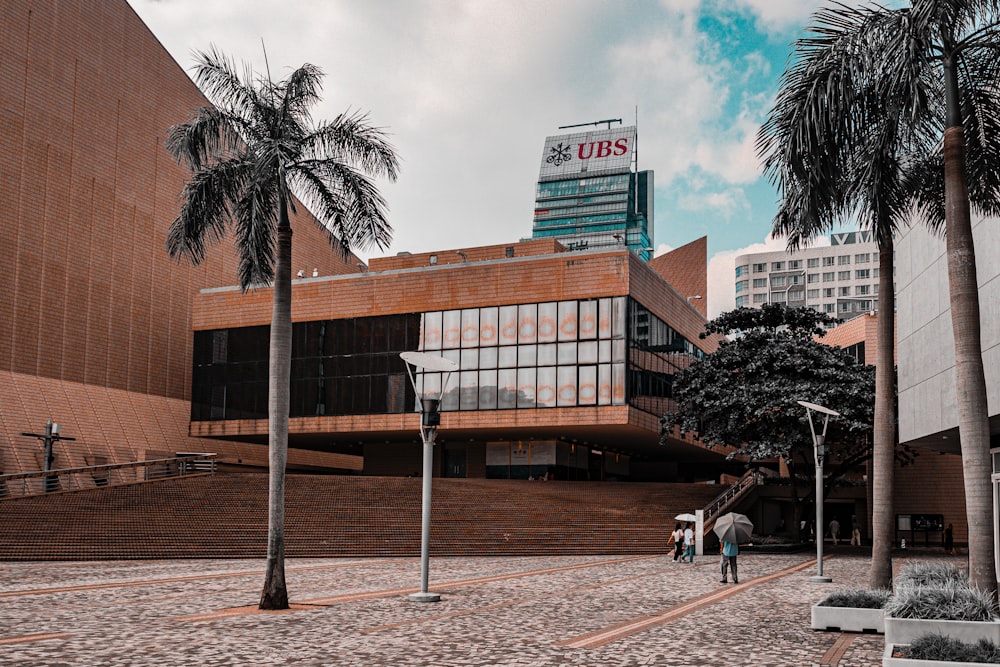 a building with palm trees in front of it