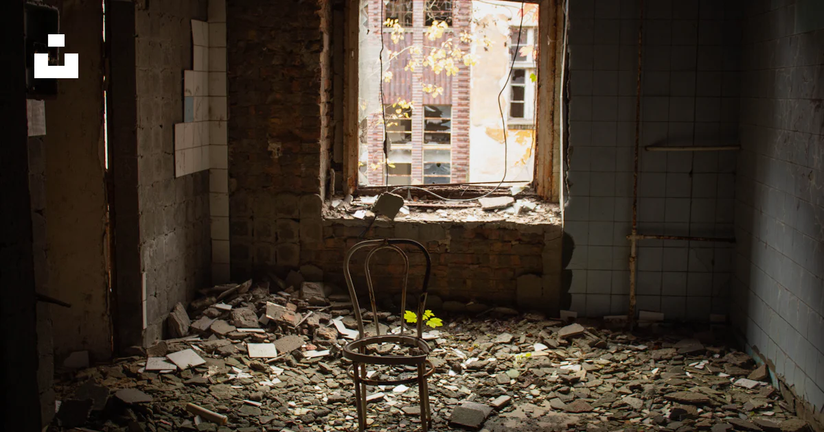 A chair in a run down room with a broken window photo – Free Beelitz ...