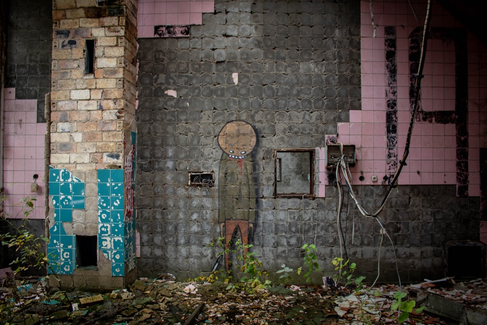 a dilapidated building with a broken door and a broken window