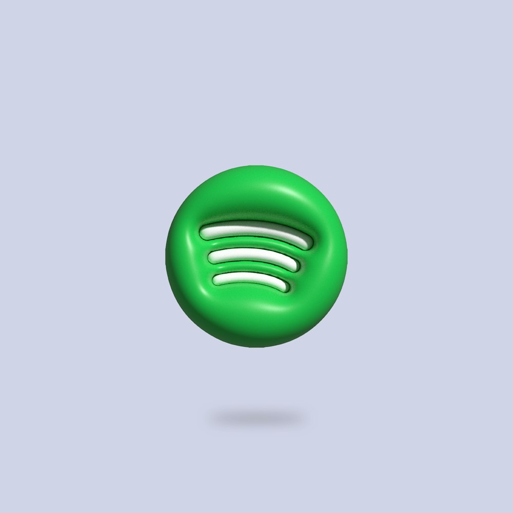 a green button with a white spot in the middle of it