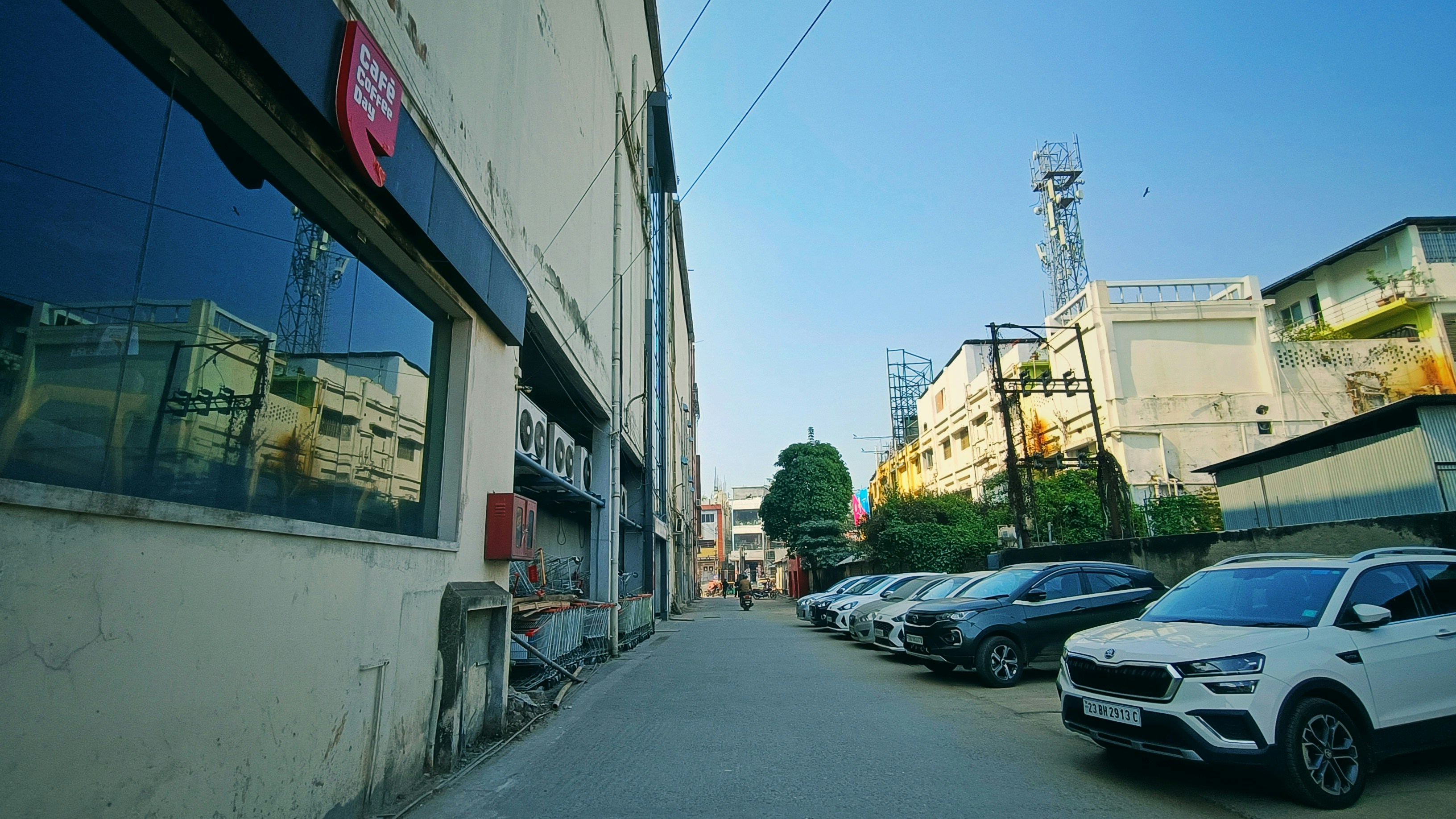 a row of parked cars in front of a building