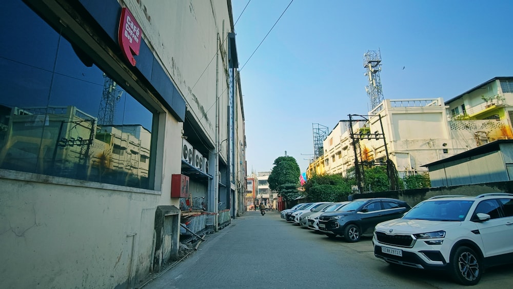 a row of parked cars in front of a building