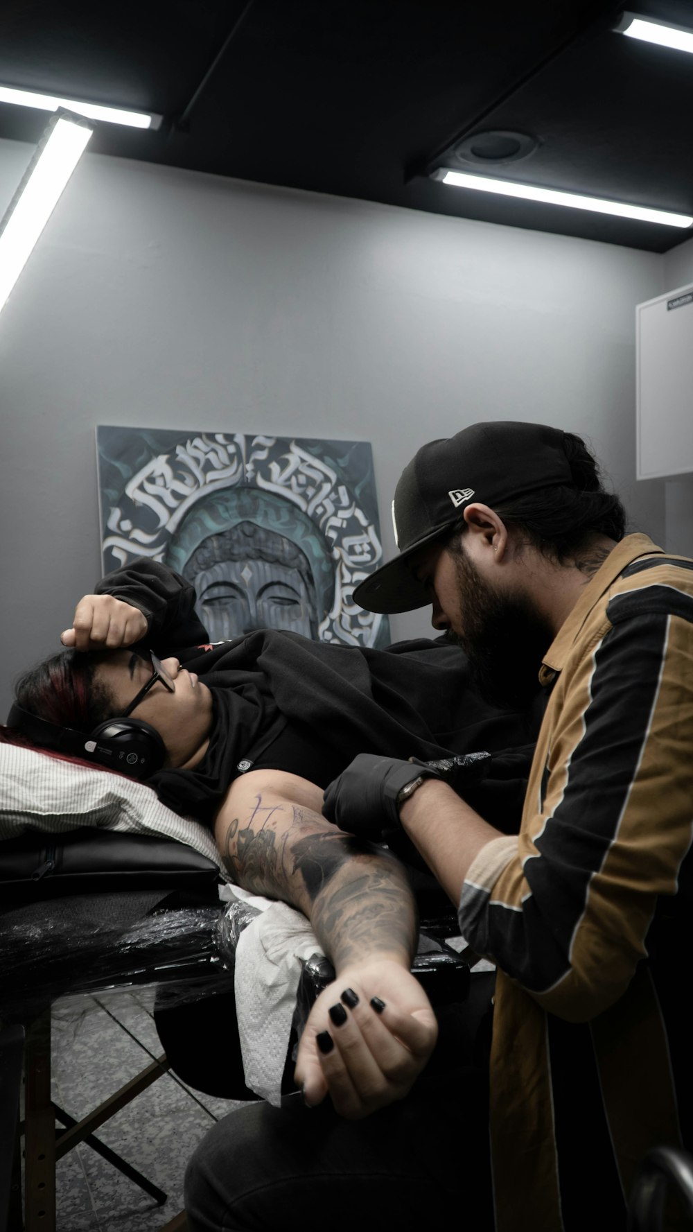 a man and a woman sitting in a barber shop