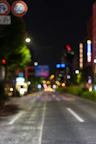 a blurry photo of a city street at night